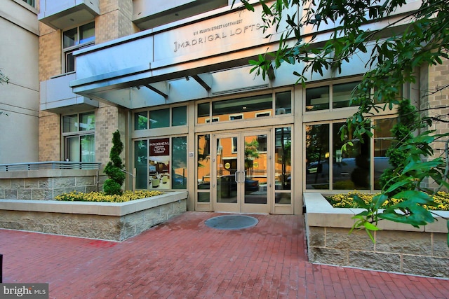 entrance to property featuring french doors and a balcony