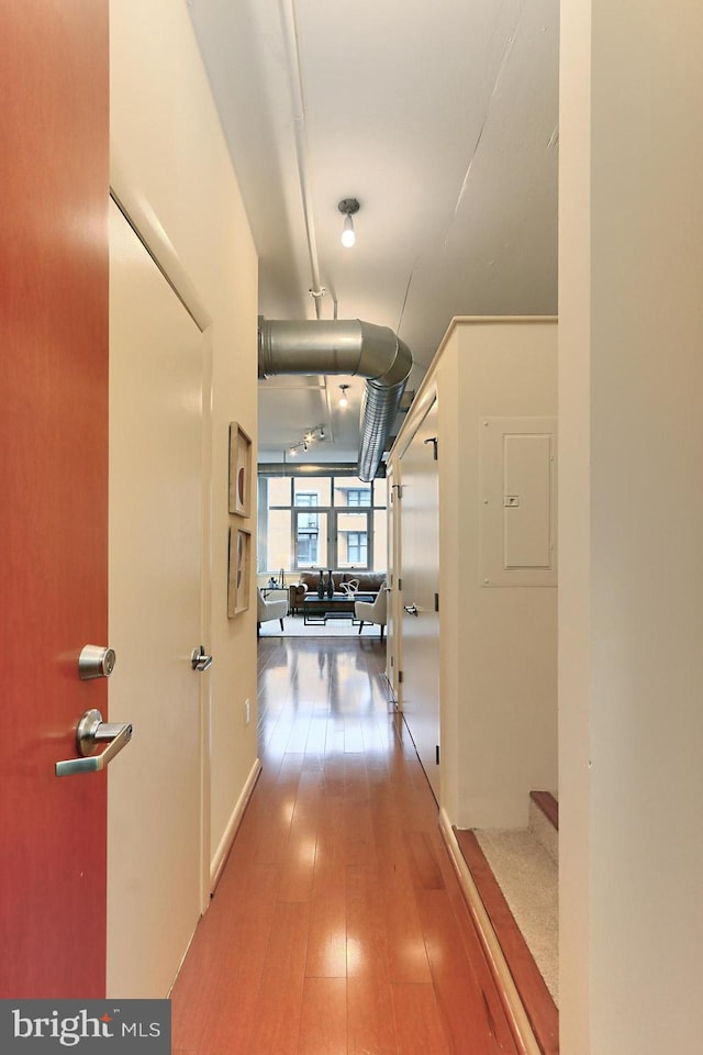 hallway with wood-type flooring