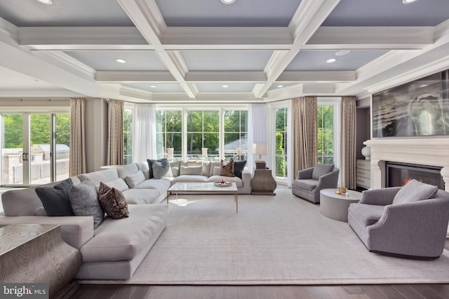 living room with beamed ceiling, hardwood / wood-style flooring, and coffered ceiling