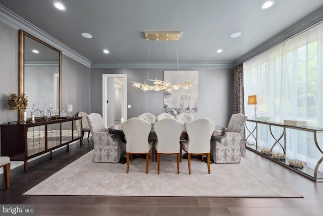 dining area featuring dark hardwood / wood-style floors and ornamental molding