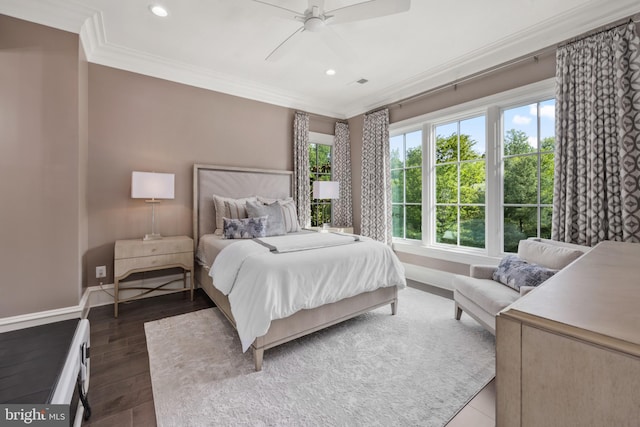 bedroom featuring crown molding, dark hardwood / wood-style flooring, and ceiling fan