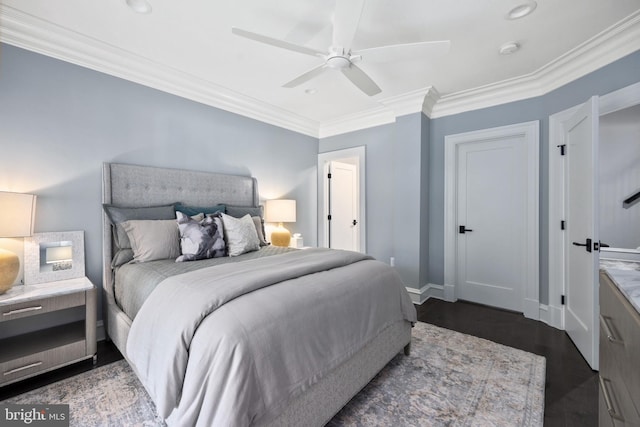 bedroom with dark hardwood / wood-style flooring, ceiling fan, and crown molding