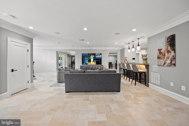 living room with light tile floors and ornamental molding