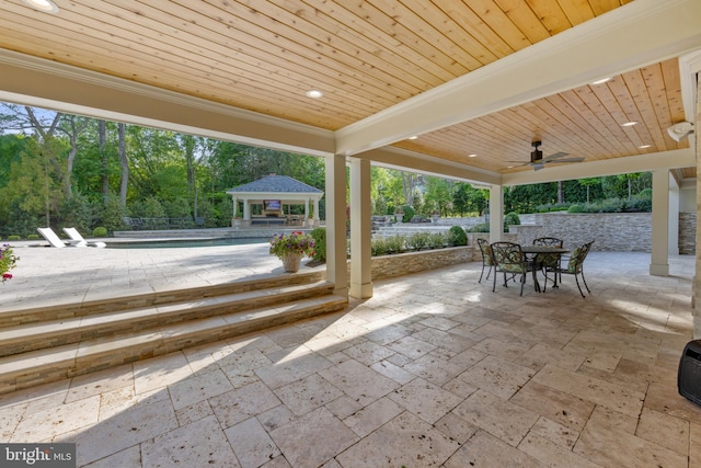 view of patio with ceiling fan and a gazebo