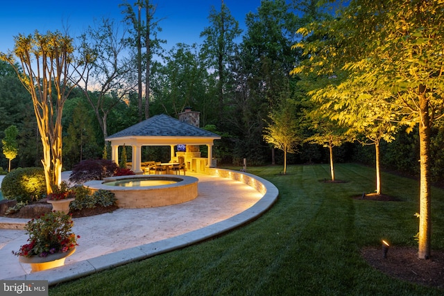 exterior space featuring a lawn and a gazebo