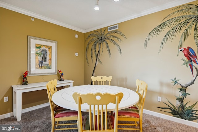 carpeted dining area with ornamental molding