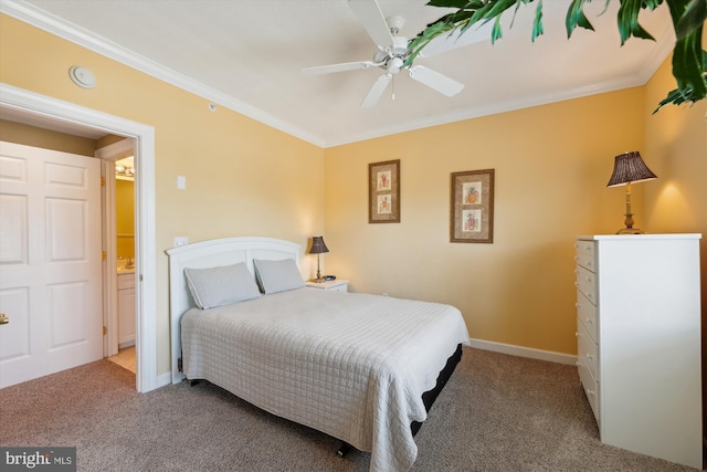 bedroom with ensuite bathroom, ceiling fan, carpet floors, and crown molding