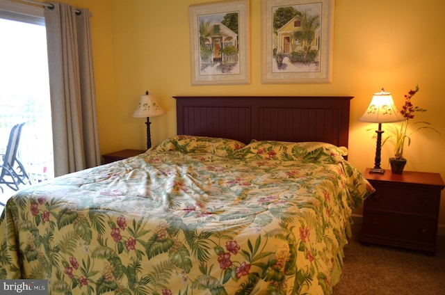 carpeted bedroom featuring multiple windows