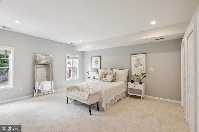 bedroom featuring light colored carpet