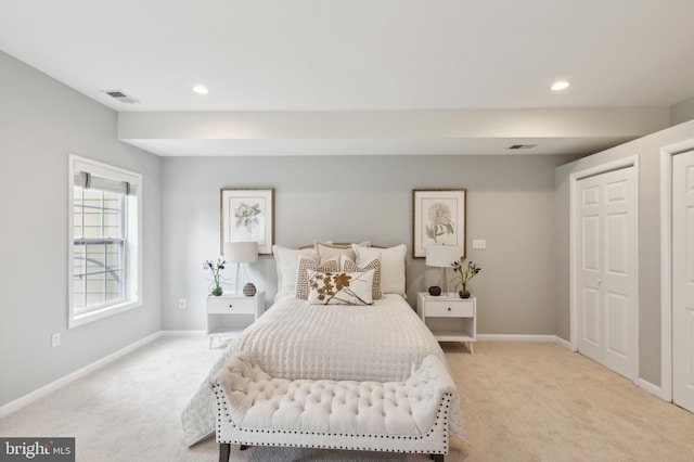 bedroom with light carpet