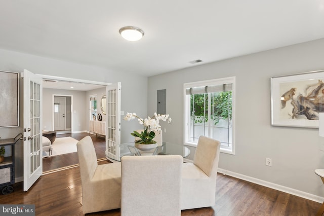 dining area featuring dark wood-type flooring and french doors