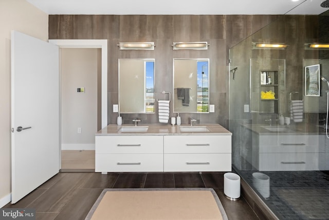 bathroom with walk in shower and double sink vanity