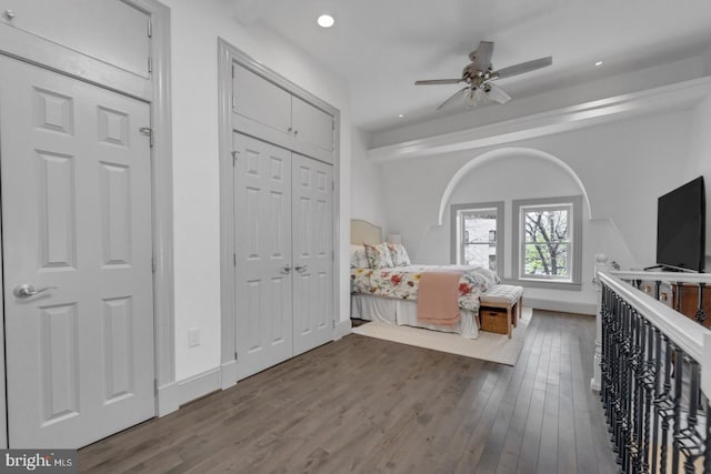 unfurnished bedroom with ceiling fan and hardwood / wood-style flooring