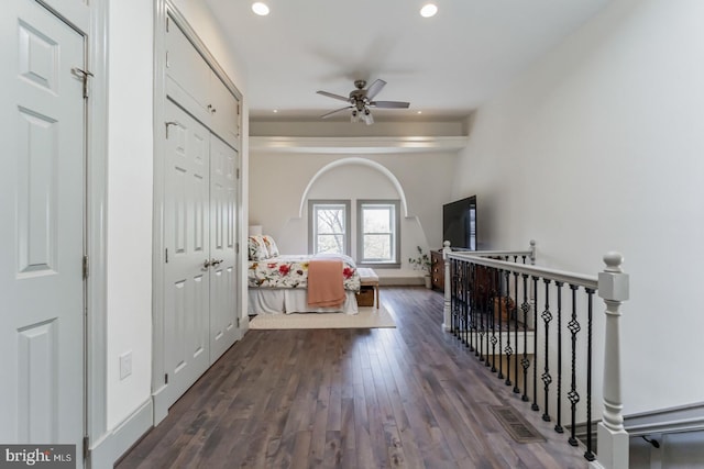 entrance foyer featuring ceiling fan and dark wood-type flooring