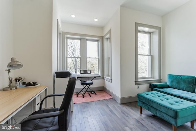 office area featuring a healthy amount of sunlight and hardwood / wood-style flooring