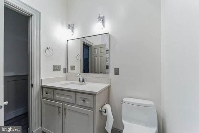 bathroom with vanity and toilet