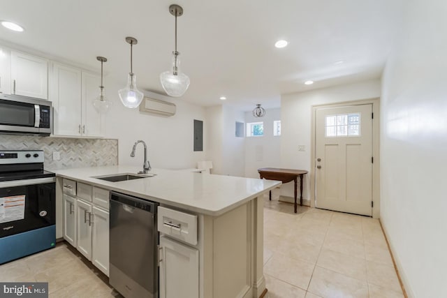 kitchen with appliances with stainless steel finishes, sink, backsplash, and light tile flooring