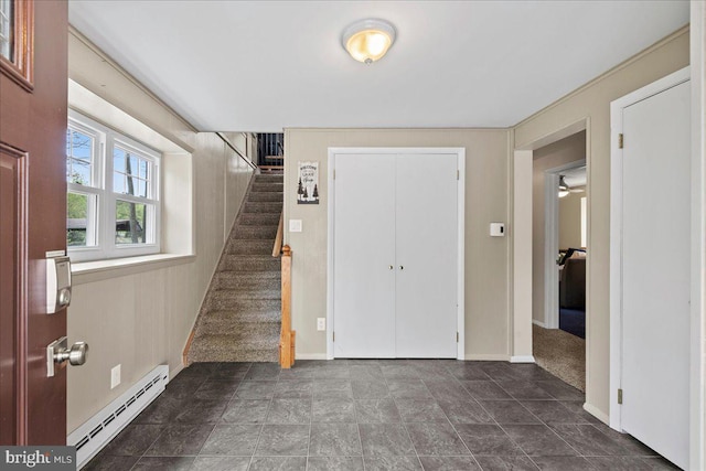 foyer featuring a baseboard heating unit