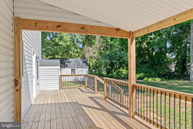 wooden deck with a yard