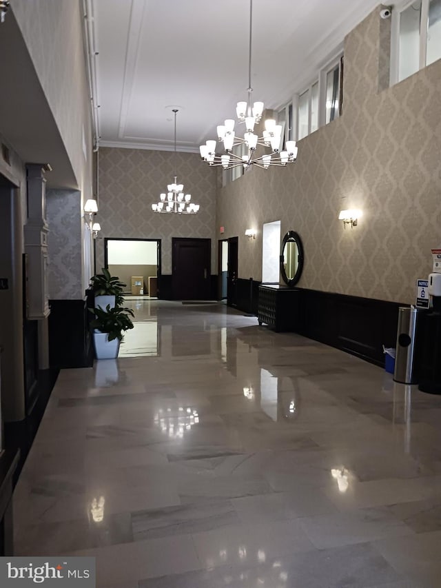 unfurnished dining area featuring a chandelier