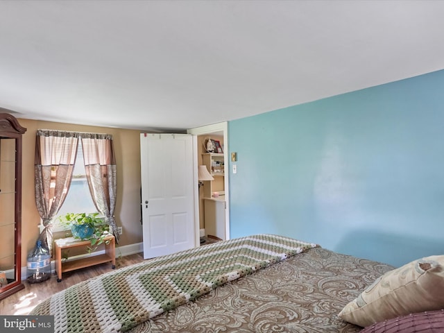 bedroom with wood-type flooring