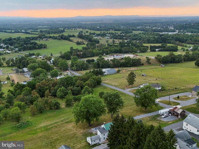 aerial view at dusk with a rural view