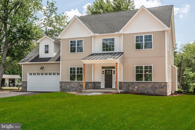 view of front of house featuring a garage and a front yard