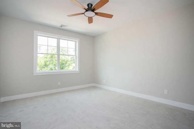 unfurnished room with light carpet and ceiling fan