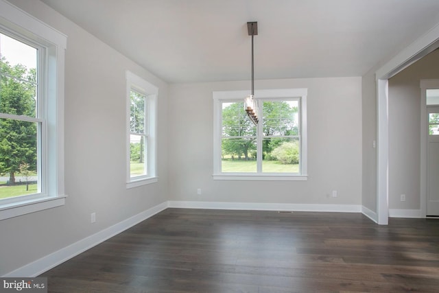 unfurnished dining area featuring dark hardwood / wood-style floors and a wealth of natural light