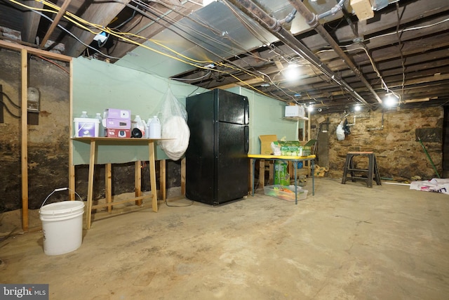 basement with black refrigerator