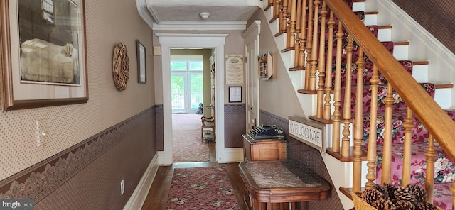 corridor featuring crown molding