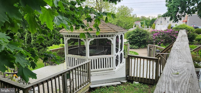 wooden terrace with a gazebo