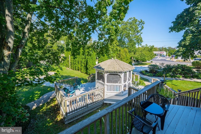 wooden deck featuring a gazebo