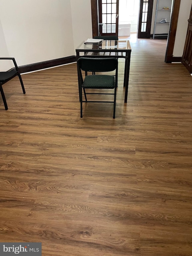 dining area with dark hardwood / wood-style flooring