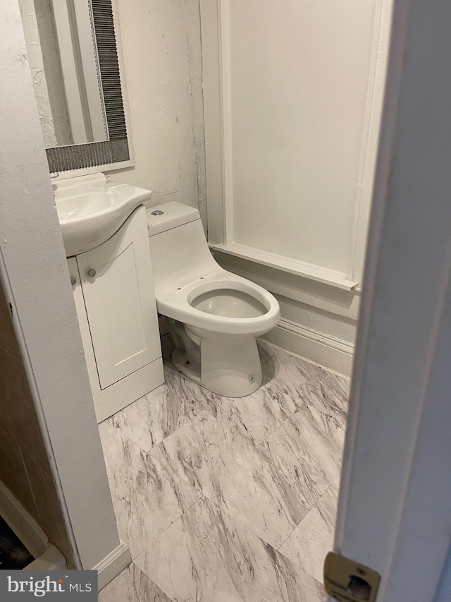 bathroom with vanity and toilet