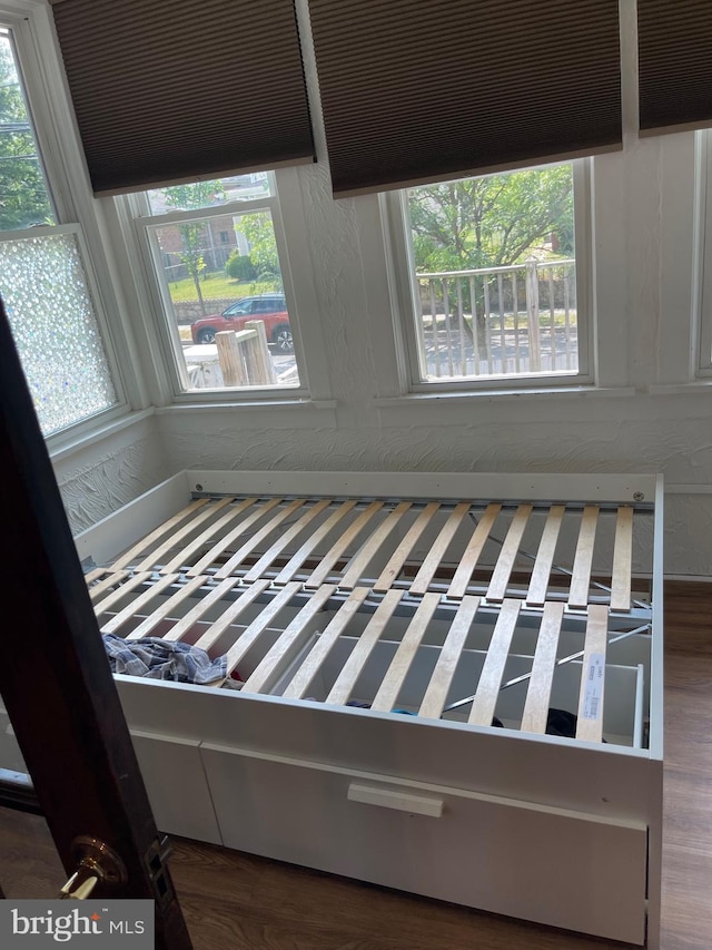 unfurnished bedroom featuring dark wood-type flooring