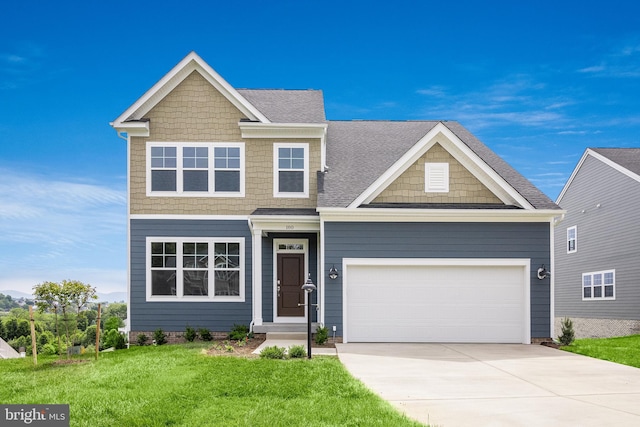 view of front of house with a garage and a front lawn