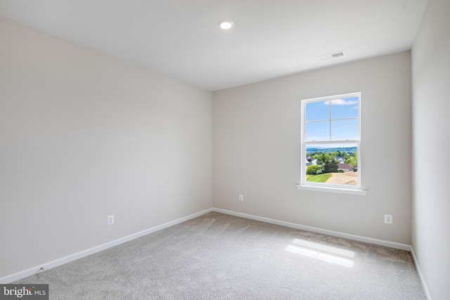 spare room featuring carpet flooring