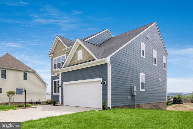 view of property exterior with a yard and a garage