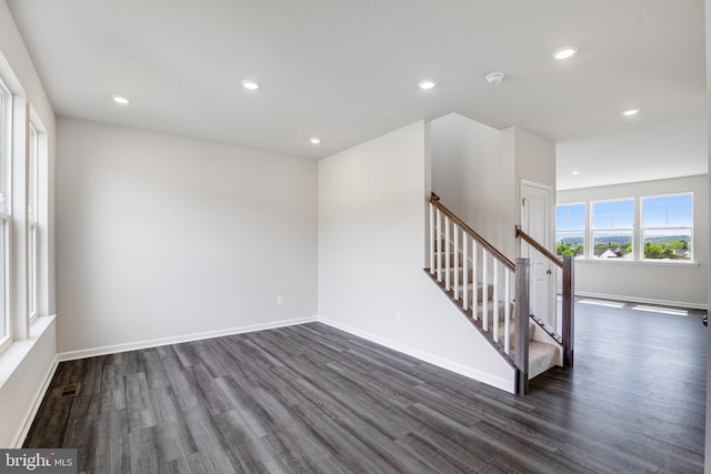 empty room featuring dark wood-type flooring