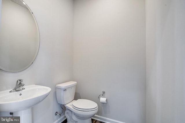 bathroom with sink and toilet