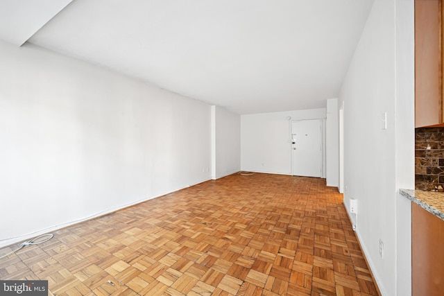 spare room featuring light parquet floors