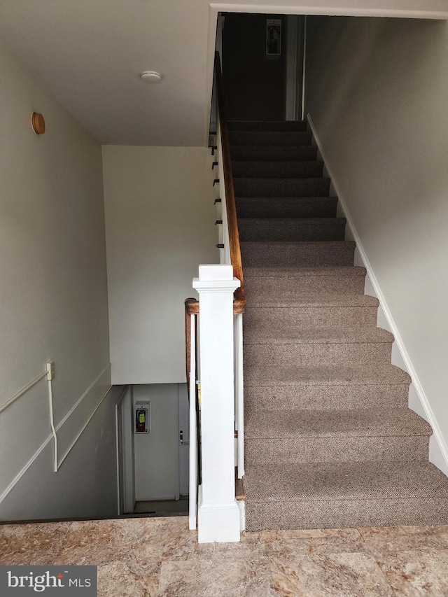 stairway with tile flooring