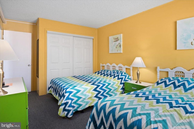 bedroom with a closet and a textured ceiling