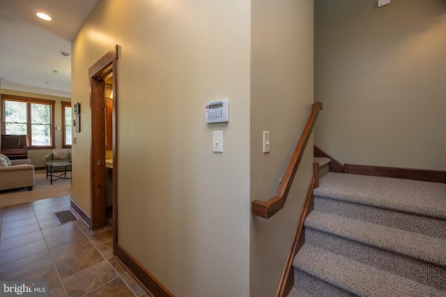 stairway featuring tile patterned floors