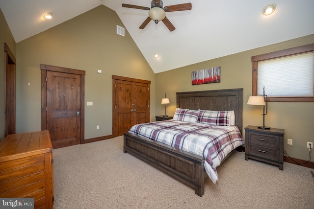 bedroom with ceiling fan, a closet, carpet, and high vaulted ceiling