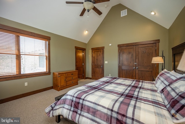 bedroom featuring ceiling fan, light colored carpet, and vaulted ceiling