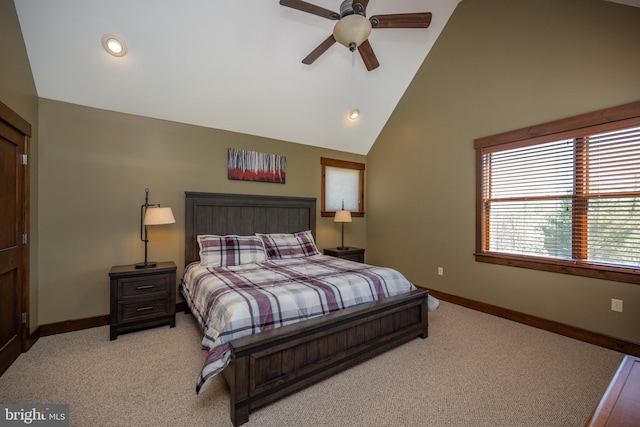 carpeted bedroom featuring ceiling fan and high vaulted ceiling