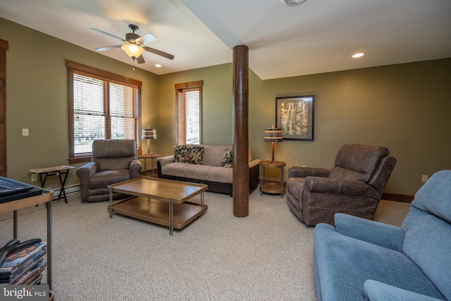 carpeted living room with baseboard heating and ceiling fan