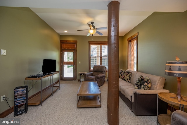 carpeted living room featuring ceiling fan